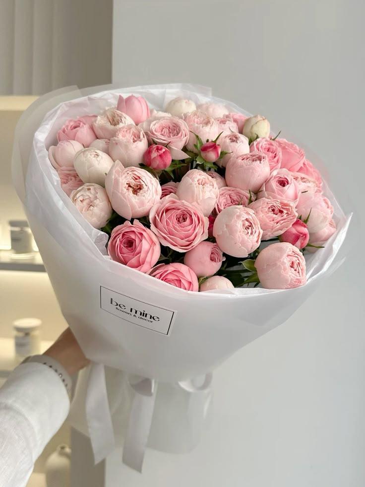 Corporate meeting room with carefully timed floral arrangements that maintain elegance throughout business hours